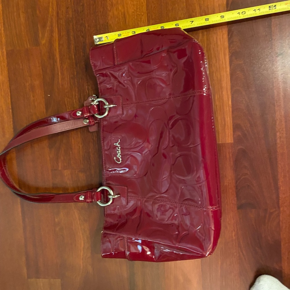 Red patent coach purse . Good condition